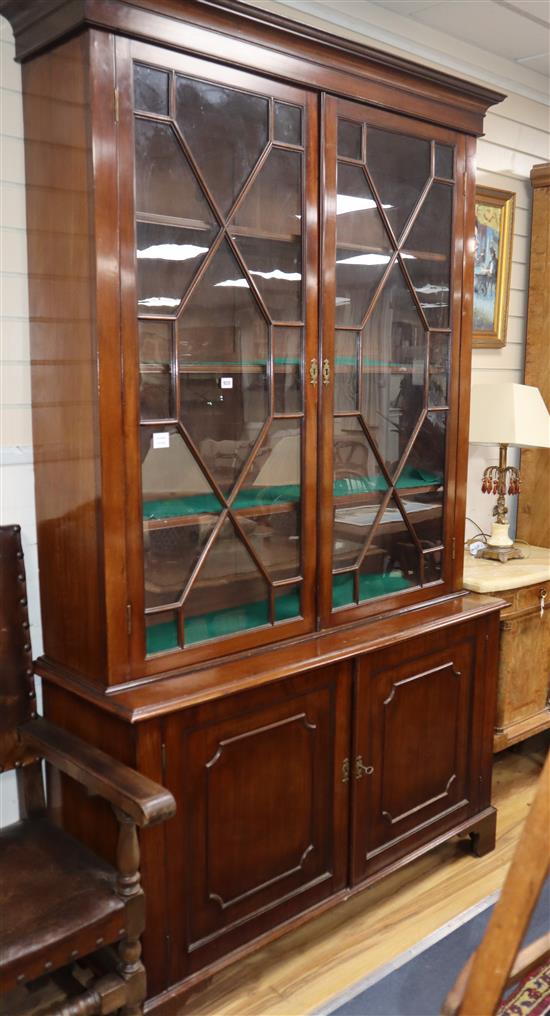 A George III style mahogany bookcase cupboard W.138cm